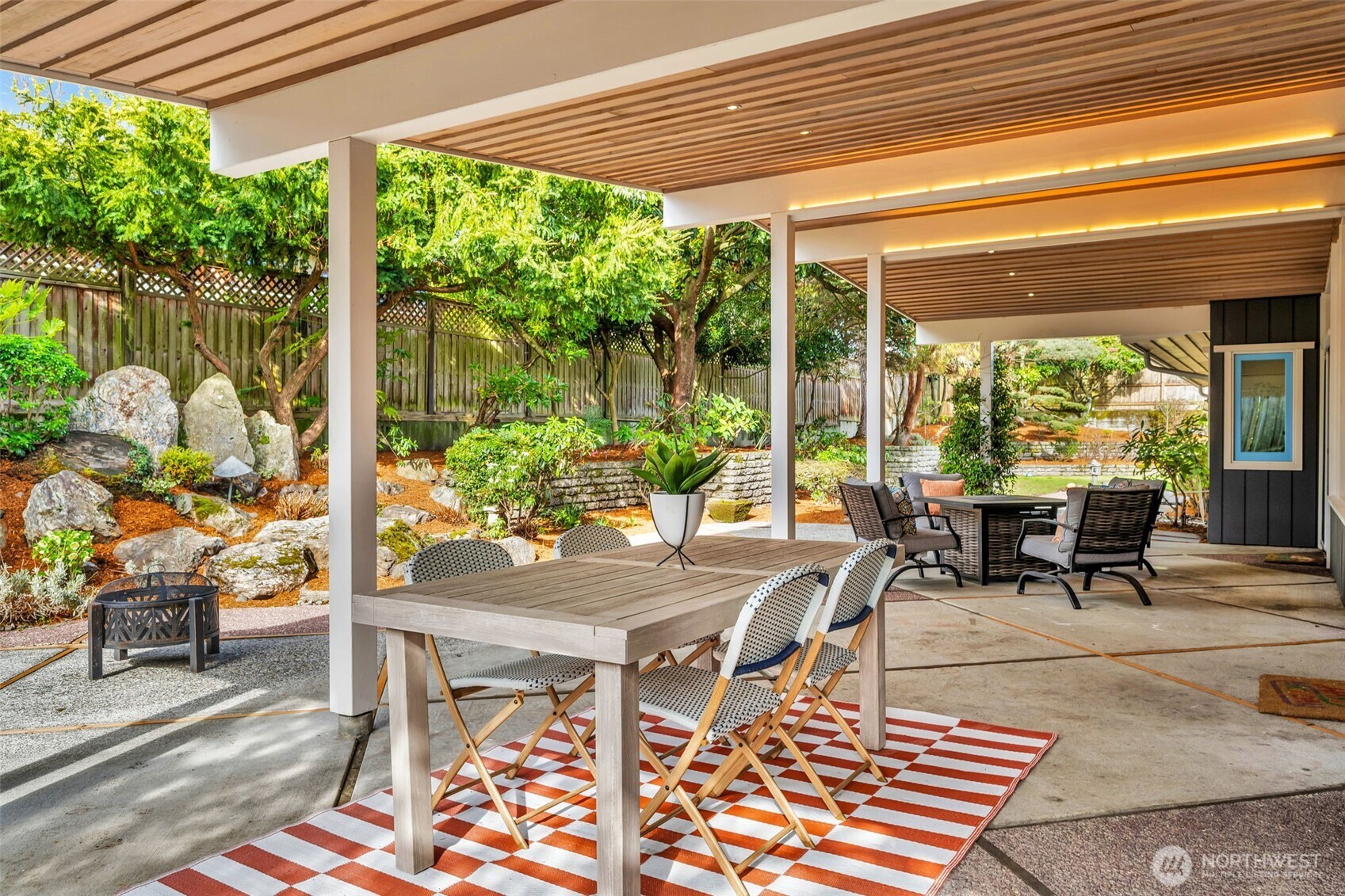 6437 Hampton Road South Seattle, WA 98118 - Photo 32 of 39 a view of a patio with a table chairs and a table