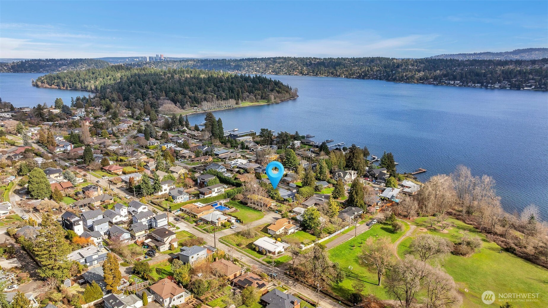 6437 Hampton Road South Seattle, WA 98118 - Photo 38 of 39 an aerial view of a house with a yard and lake view