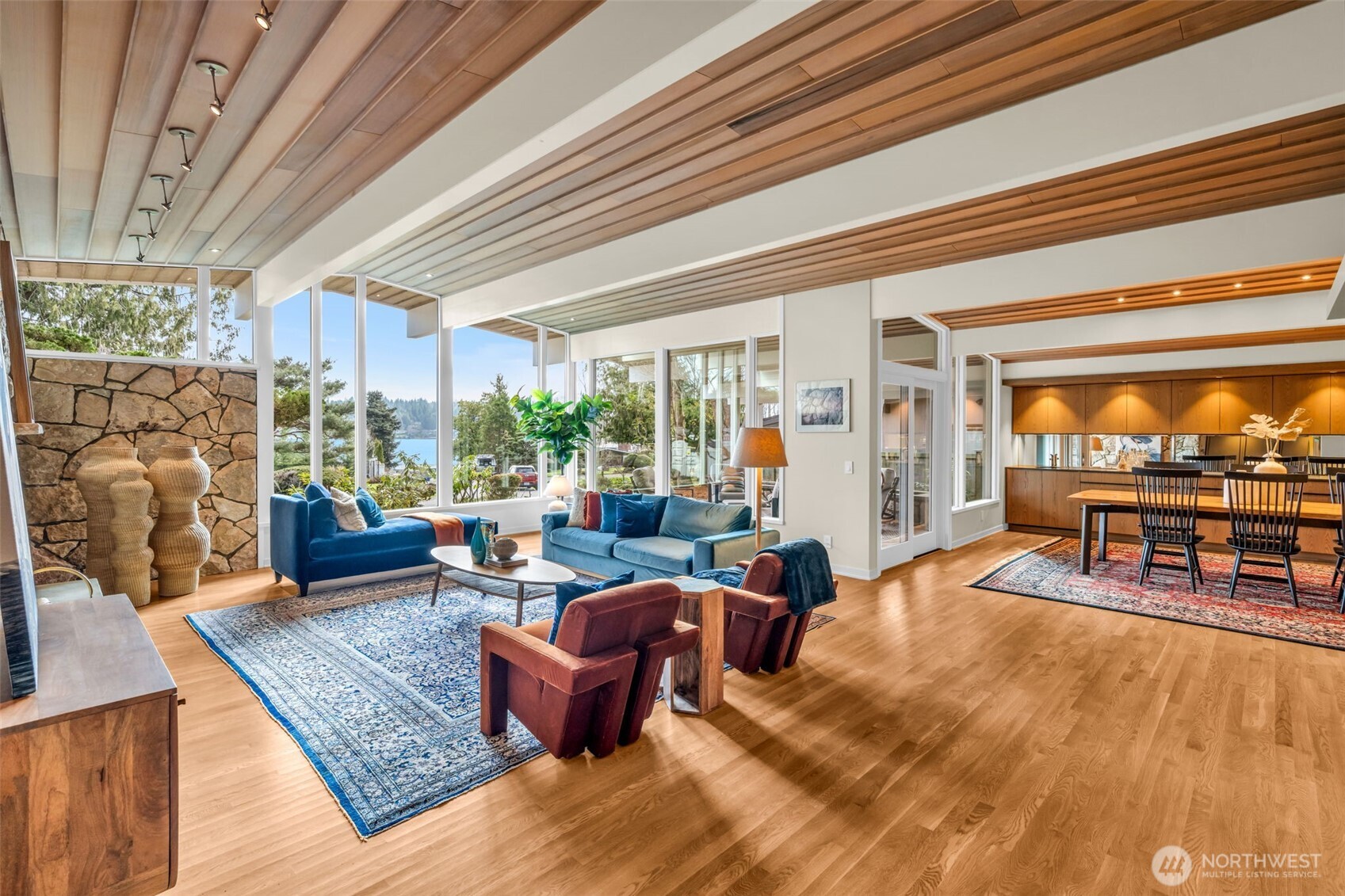 6437 Hampton Road South Seattle, WA 98118 - Photo 5 of 39 a living room with patio furniture and a floor to ceiling window