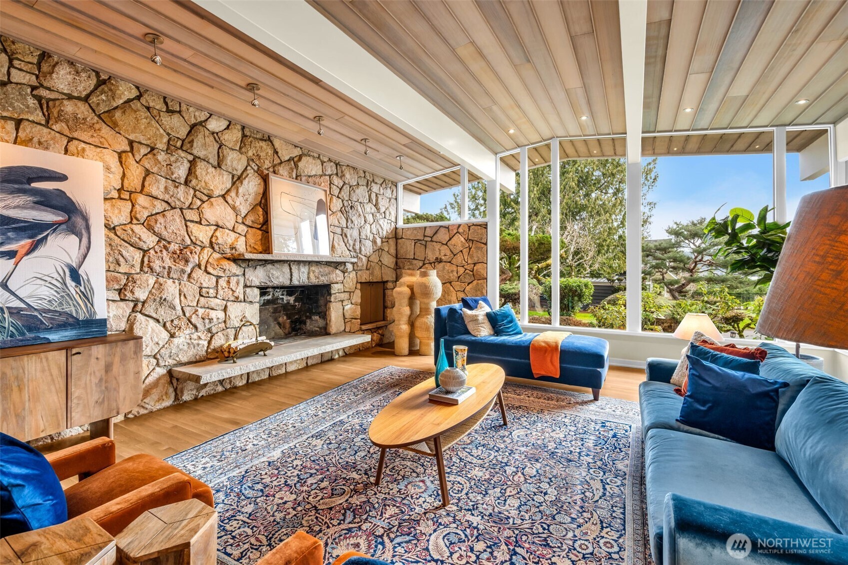 6437 Hampton Road South Seattle, WA 98118 - Photo 9 of 39 a outdoor living space with patio furniture and a fireplace