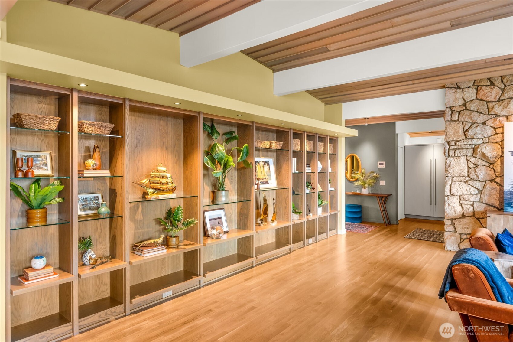 6437 Hampton Road South Seattle, WA 98118 - Photo 10 of 39 a view of a hallway with wooden floor and furniture
