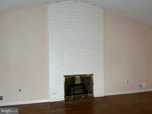 a room with a door and wooden floor