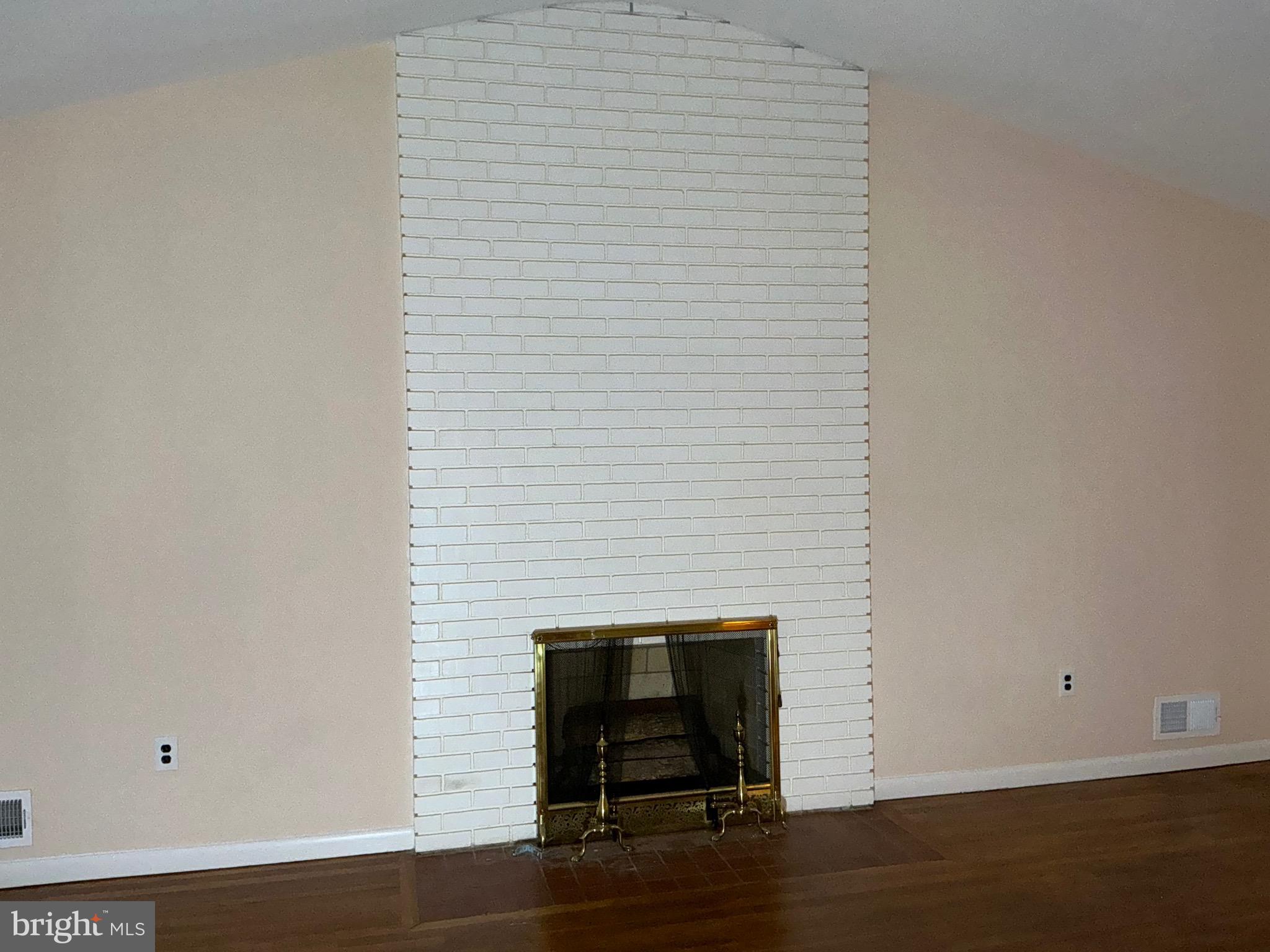 303 Charlton Court Silver Spring, MD 20902 - Photo 13 of 45 a room with a door and wooden floor