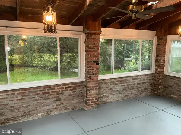 a view of backyard with porch and outdoor space