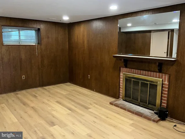 a bedroom with a bed and a fireplace