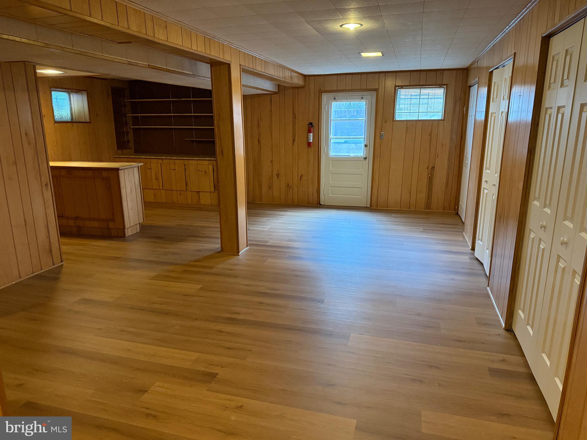303 Charlton Court Silver Spring, MD 20902 - Photo 45 of 45 an empty room with wooden floor and windows