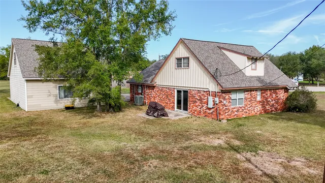a view of a house with a yard and garage