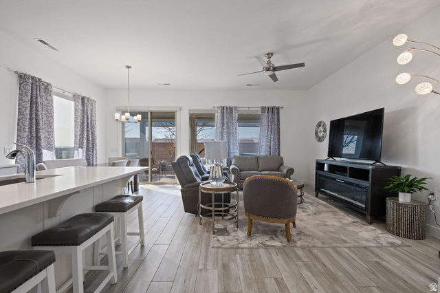 4708 Martin Drive St. George, UT 84790 - Photo 6 of 28 Living area with a chandelier, light wood-type flooring, and ceiling fan