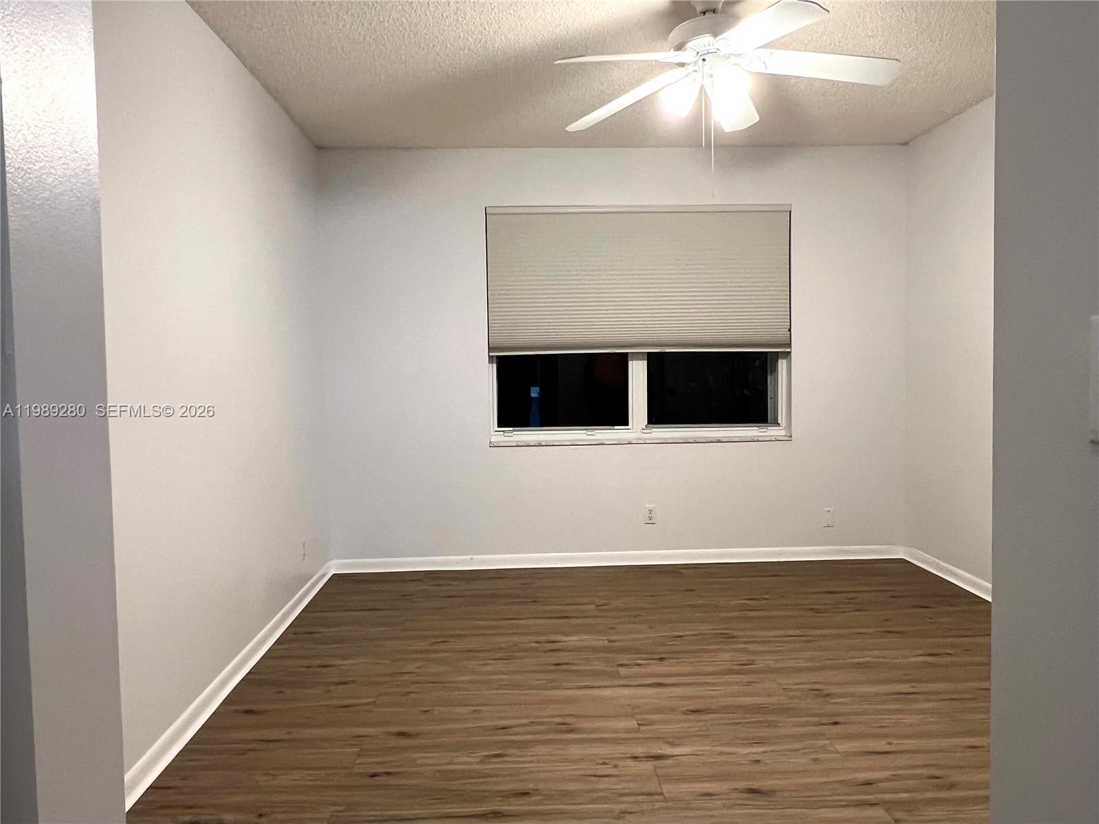 543 Racquet Club Road, Unit 33 Weston, FL 33326 - Photo 19 of 28 a view of wooden floor in a room
