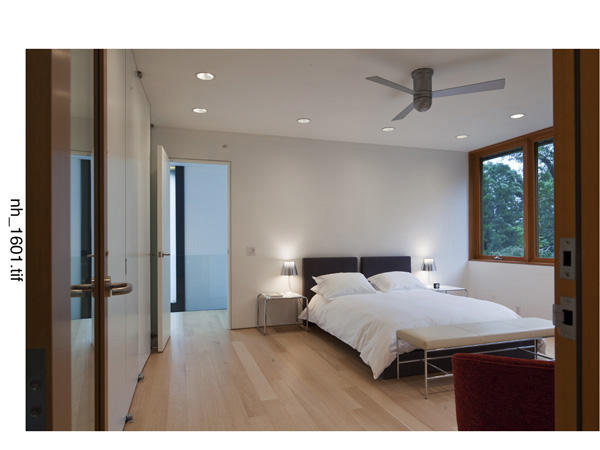 Undisclosed Address Wilton, CT 06897 - Photo 18 of 25 a bedroom with a bed and a large window