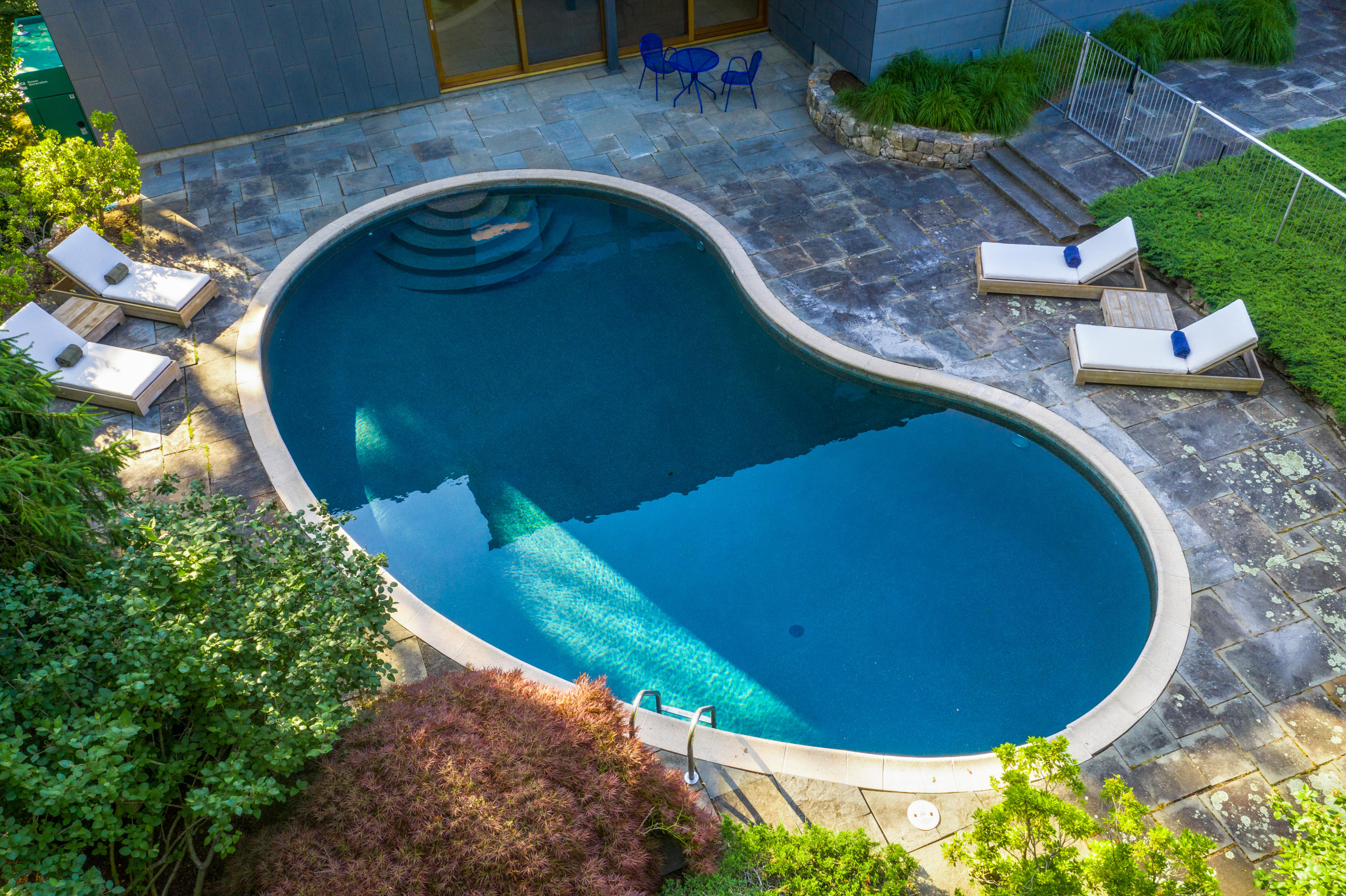 Undisclosed Address Wilton, CT 06897 - Photo 19 of 25 a view of a swimming pool with a patio