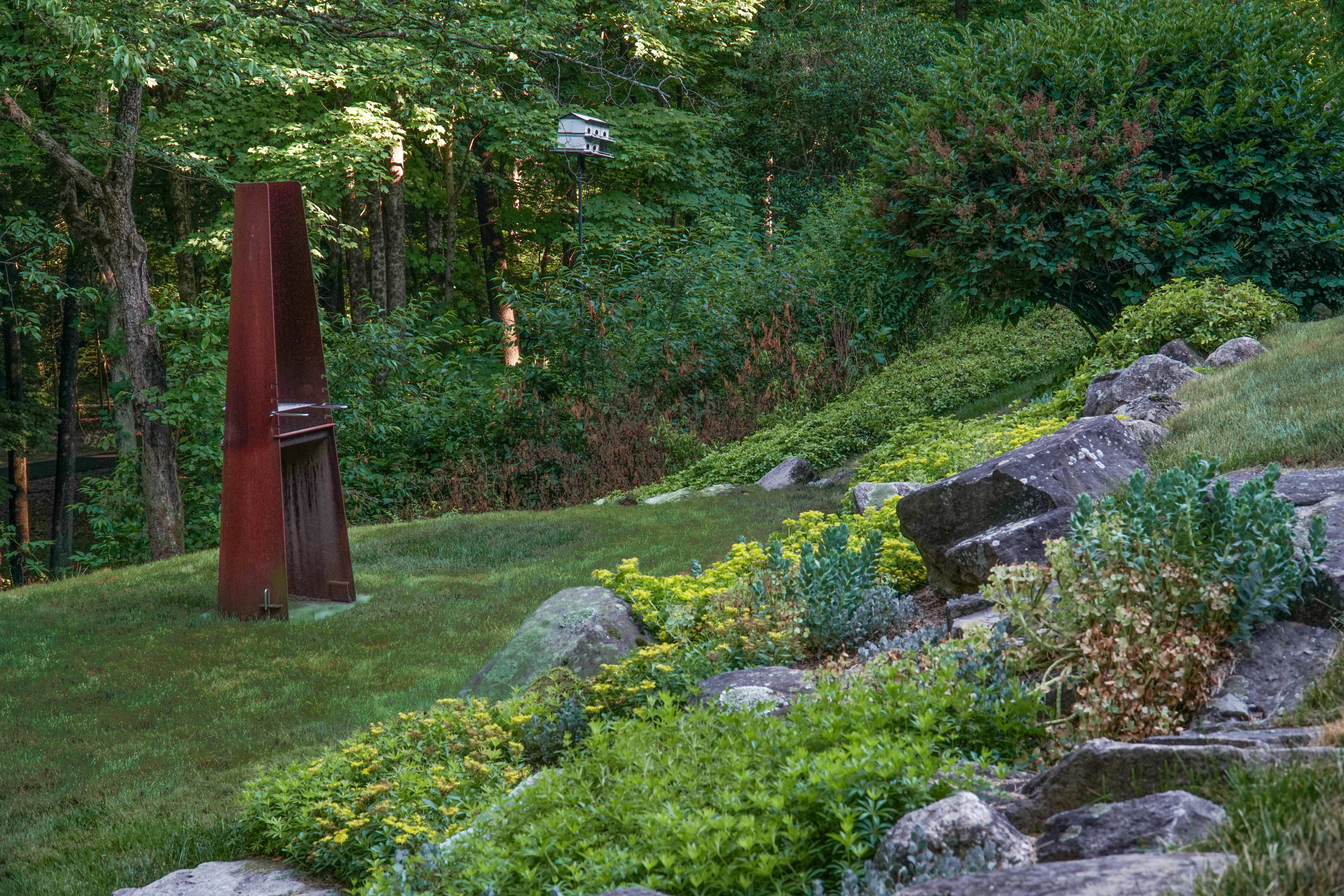 Undisclosed Address Wilton, CT 06897 - Photo 23 of 25 a view of a garden with large trees
