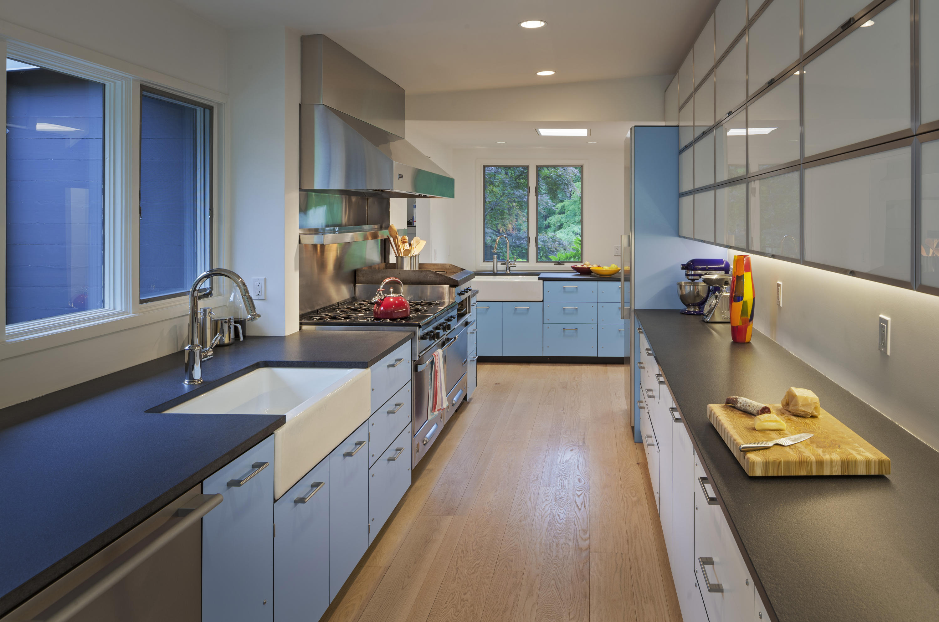 Undisclosed Address Wilton, CT 06897 - Photo 7 of 25 a kitchen with stainless steel appliances double sink and wooden floor