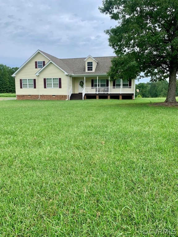 8117 Baltimore Road Ford, VA 23850 - Photo 1 of 26 a view of a white house with a big yard and large trees