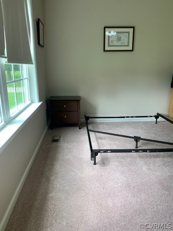 8117 Baltimore Road Ford, VA 23850 - Photo 11 of 26 a room with a wooden floor and a window
