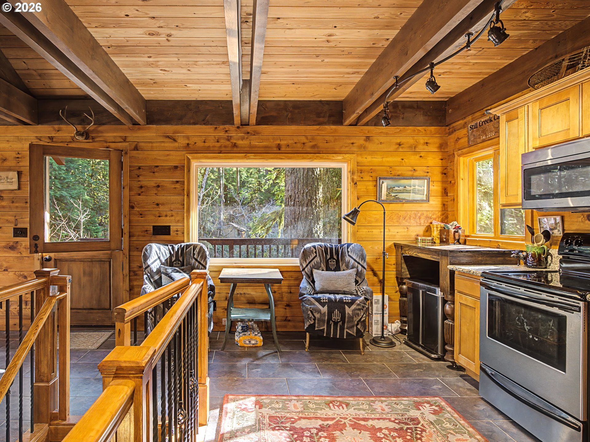 28910 Road 12 Rhododendron, OR 97049 - Photo 14 of 48 a view of a kitchen with furniture and a stove