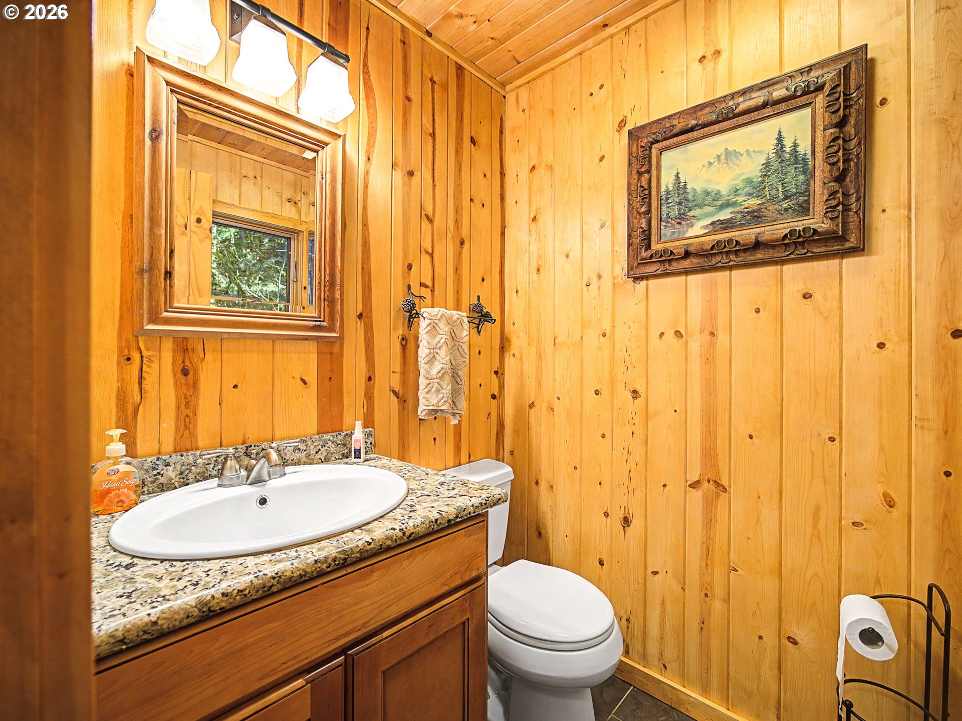 28910 Road 12 Rhododendron, OR 97049 - Photo 17 of 48 a bathroom with a granite countertop sink and a mirror