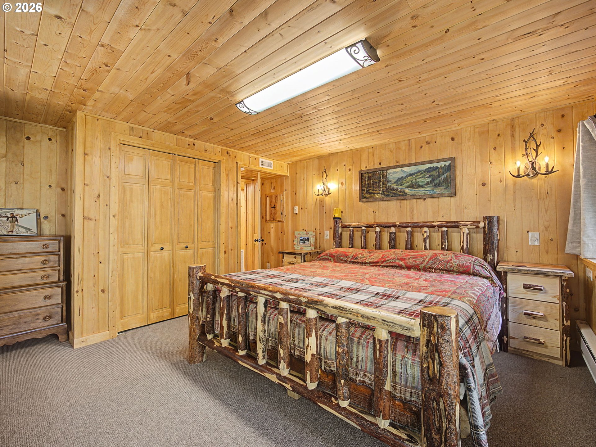 28910 Road 12 Rhododendron, OR 97049 - Photo 20 of 48 a spacious bedroom with a bed and a table