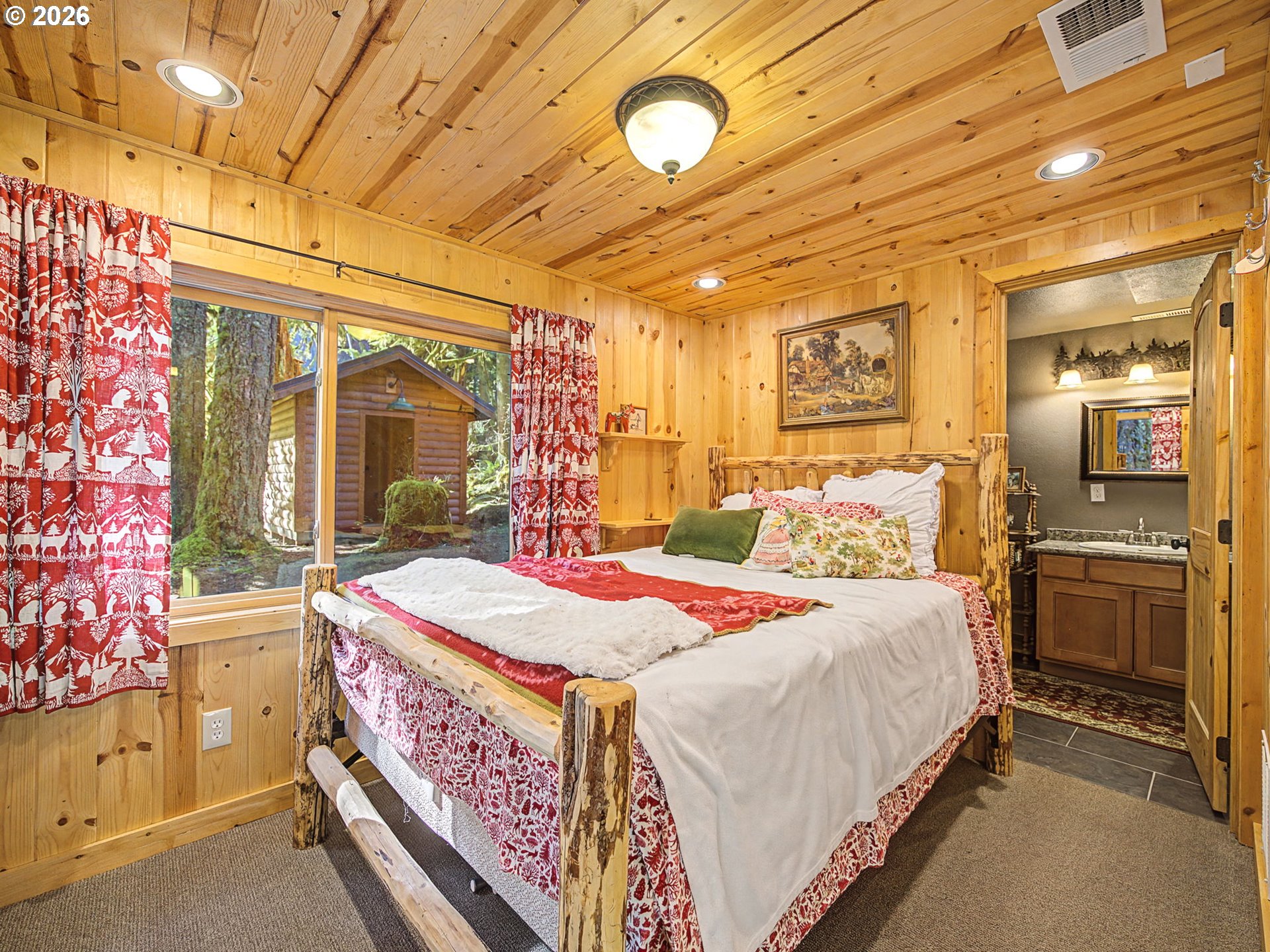 28910 Road 12 Rhododendron, OR 97049 - Photo 22 of 48 a bed room with a bed and a refrigerator