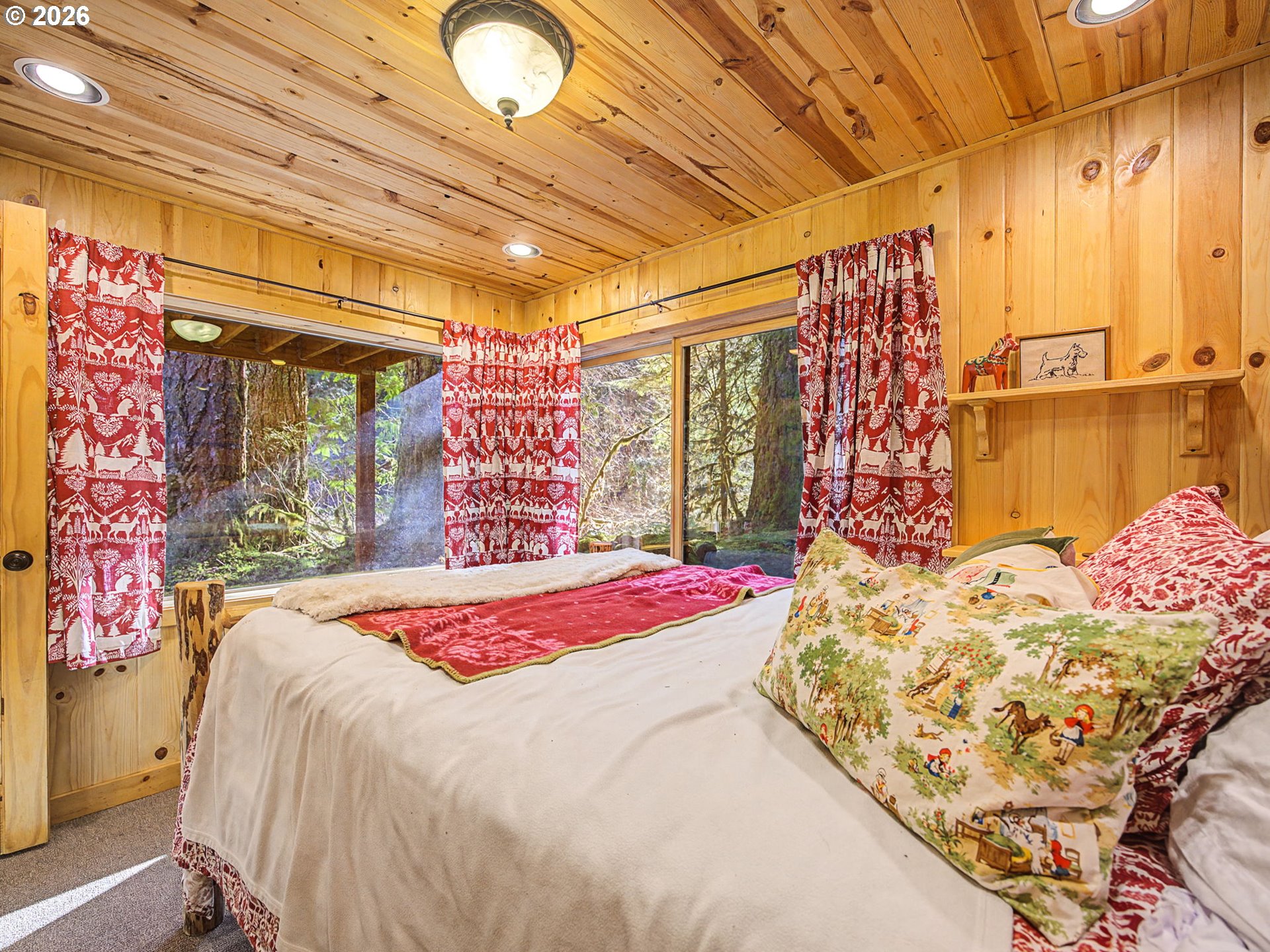 28910 Road 12 Rhododendron, OR 97049 - Photo 23 of 48 a bedroom with a bed and a chandelier