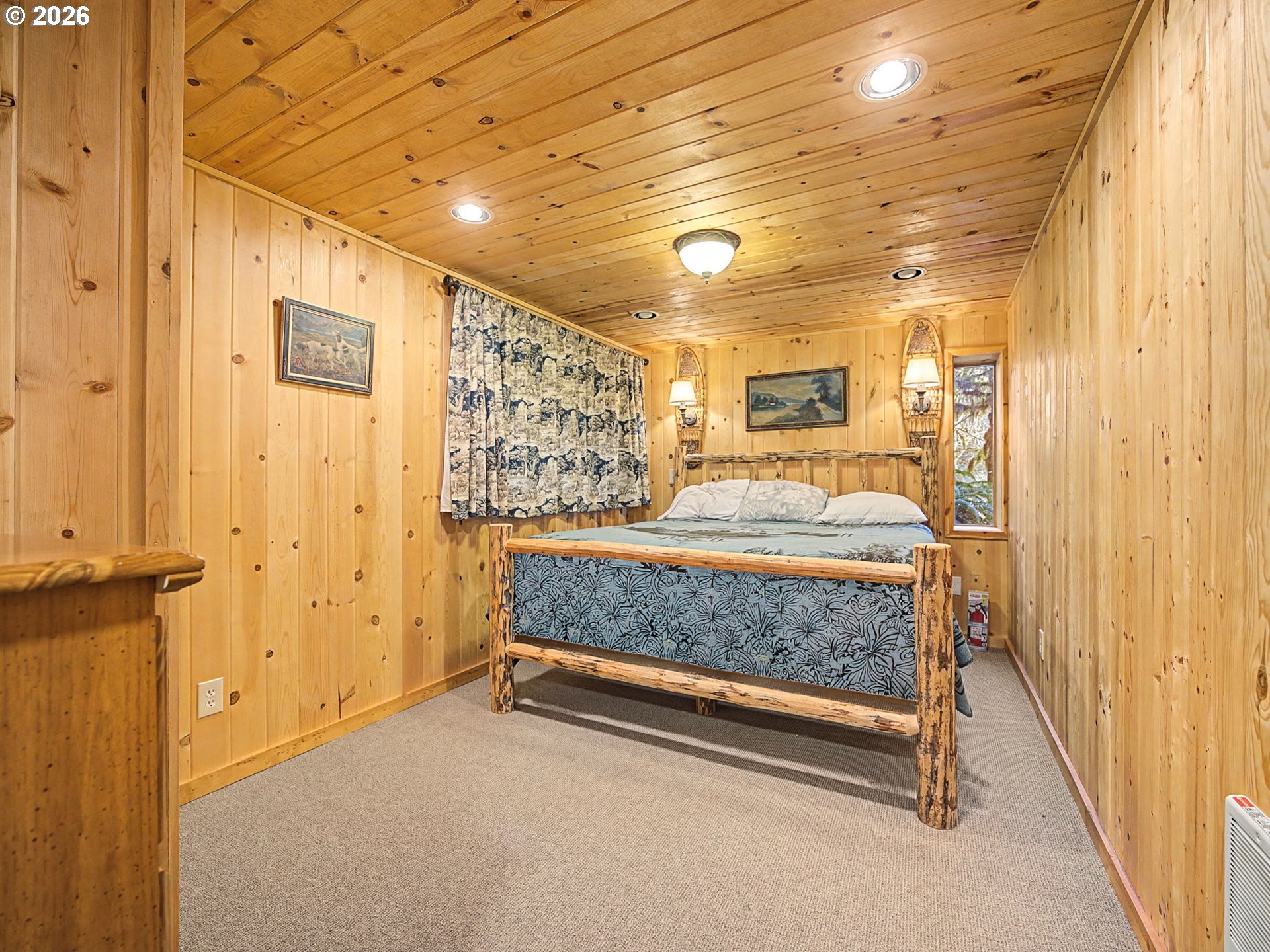 28910 Road 12 Rhododendron, OR 97049 - Photo 24 of 48 a bedroom with a bed and a window