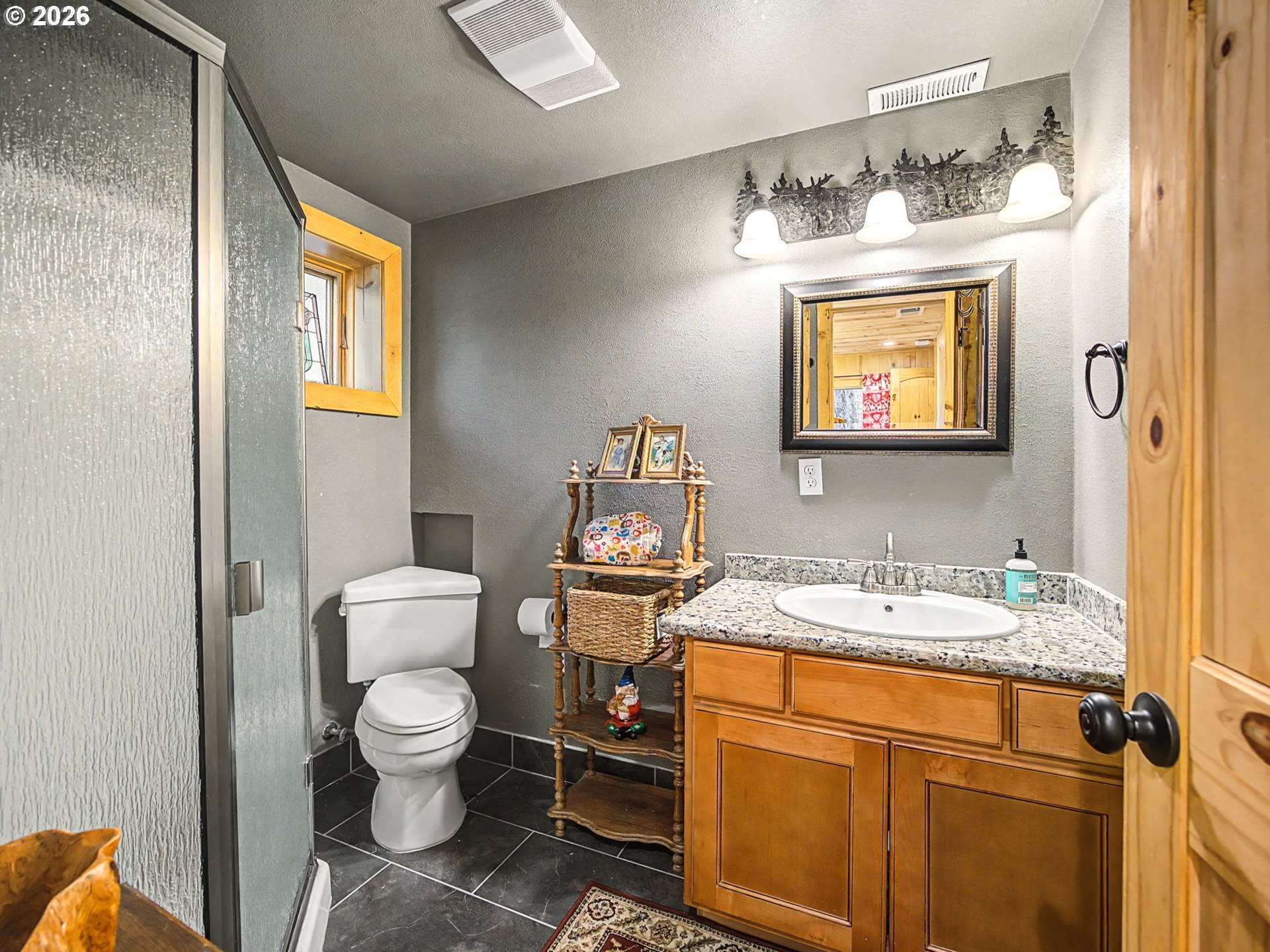 28910 Road 12 Rhododendron, OR 97049 - Photo 27 of 48 a bathroom with a toilet sink and mirror
