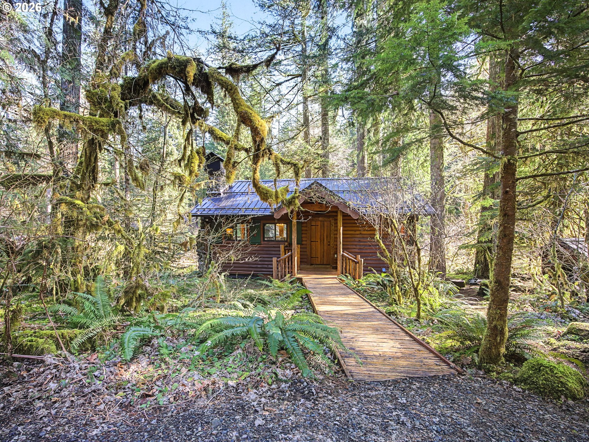28910 Road 12 Rhododendron, OR 97049 - Photo 3 of 48 a backyard of a house with table and chairs