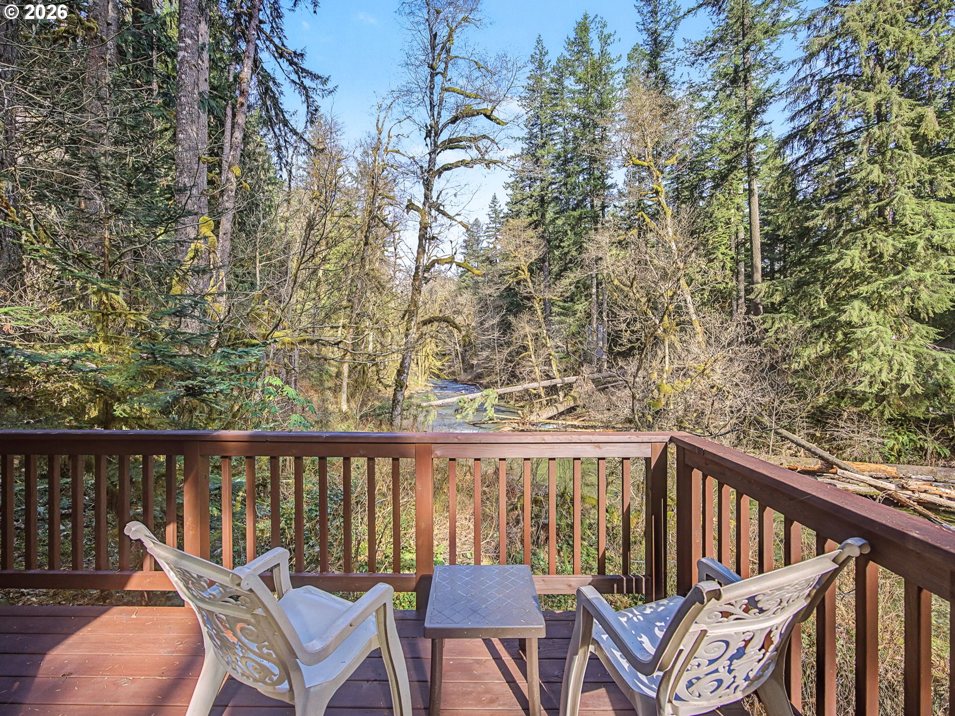 28910 Road 12 Rhododendron, OR 97049 - Photo 35 of 48 a view of a chair and table on the deck