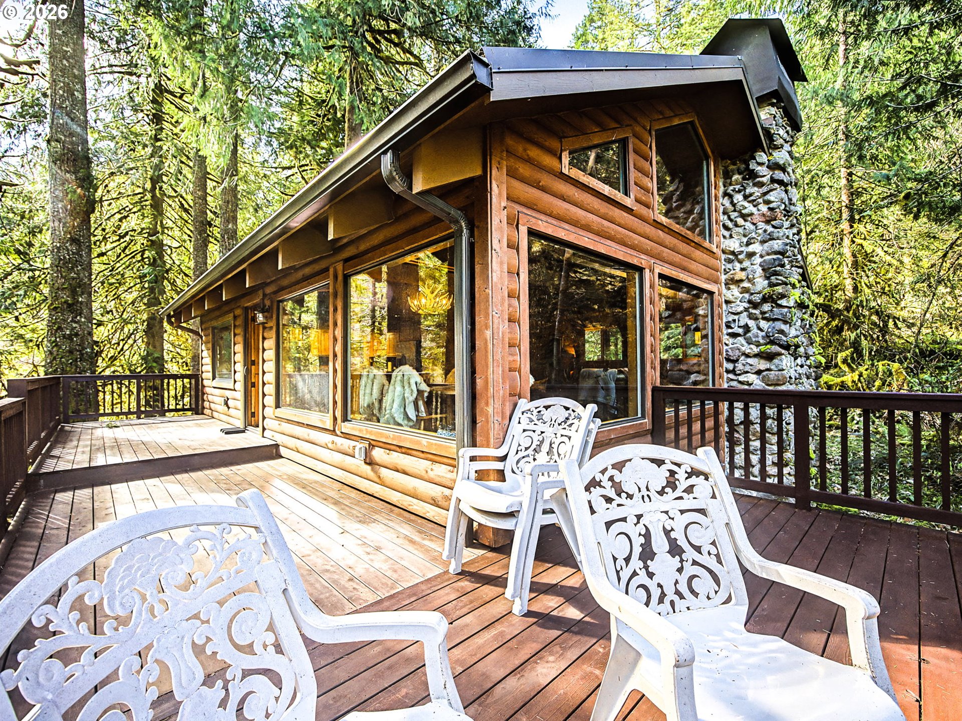 28910 Road 12 Rhododendron, OR 97049 - Photo 38 of 48 a view of a patio with two couches chairs and a wooden floor