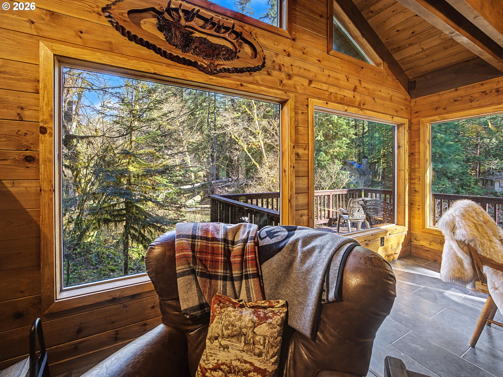 28910 Road 12 Rhododendron, OR 97049 - Photo 9 of 48 a view of a city from a dining room with large windows
