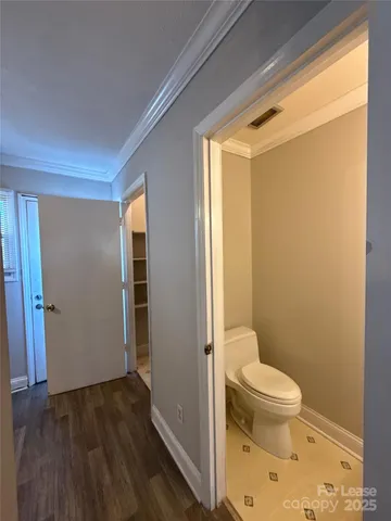 an empty room with a window and a ceiling fan