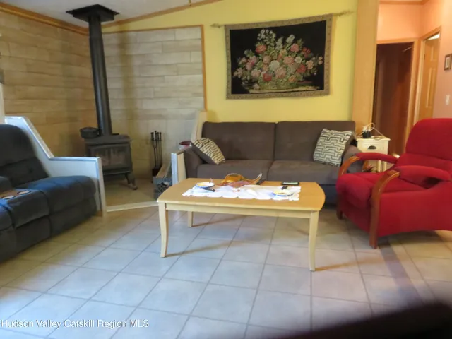 a living room with furniture and a rug