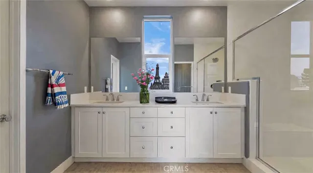 a bathroom with a sink vanity and a mirror