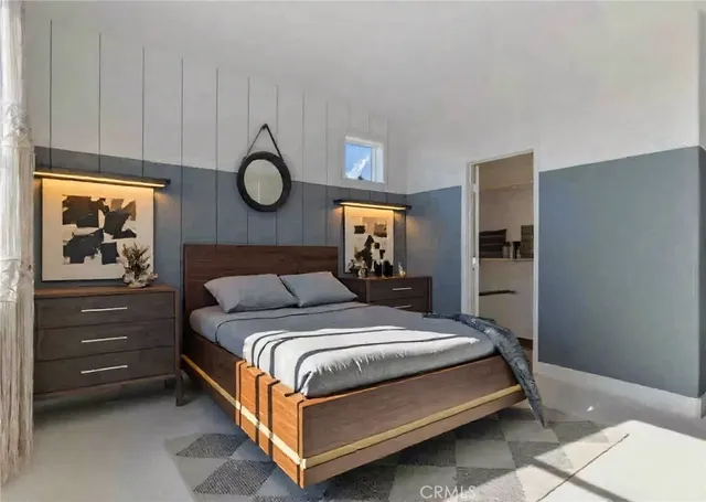 a bedroom with a bed and cabinets