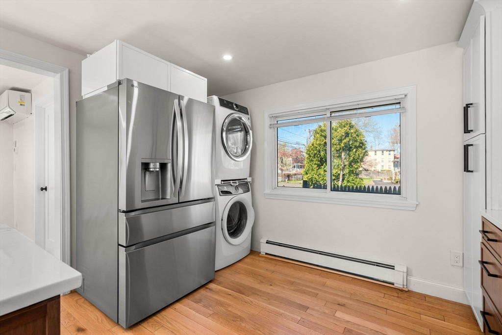271 Broadway Haverhill, MA 01832 - Photo 17 of 41 a metallic refrigerator freezer sitting in a kitchen