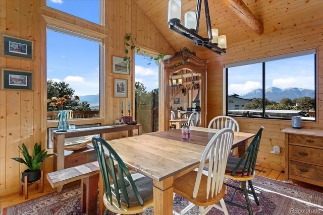 a view of a patio with a table and chairs