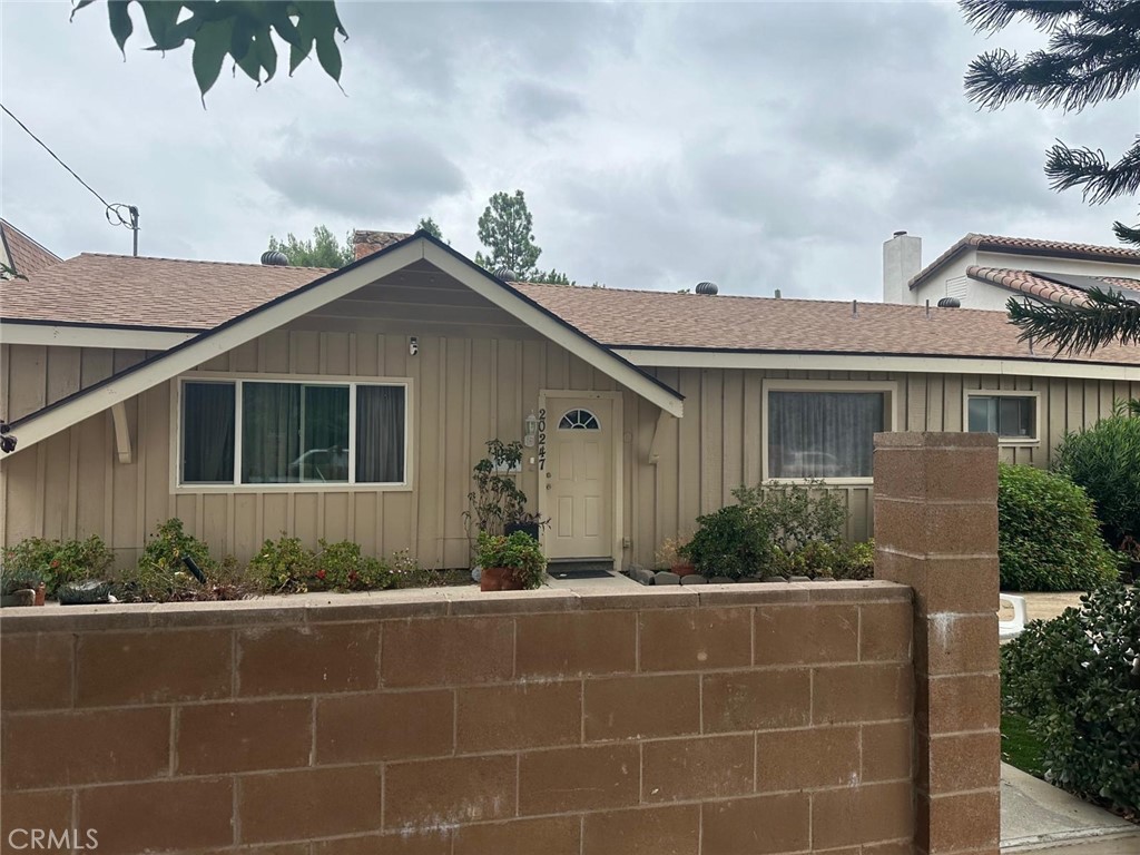 20247 Lanark Street Winnetka, CA 91306 - Photo 1 of 1 a front view of a house with potted plants