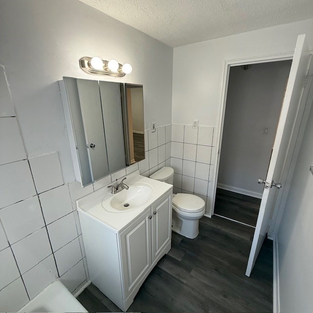 29 Gordon Street, Unit 107 Framingham, MA 01702 - Photo 13 of 17 a bathroom with a toilet sink and mirror