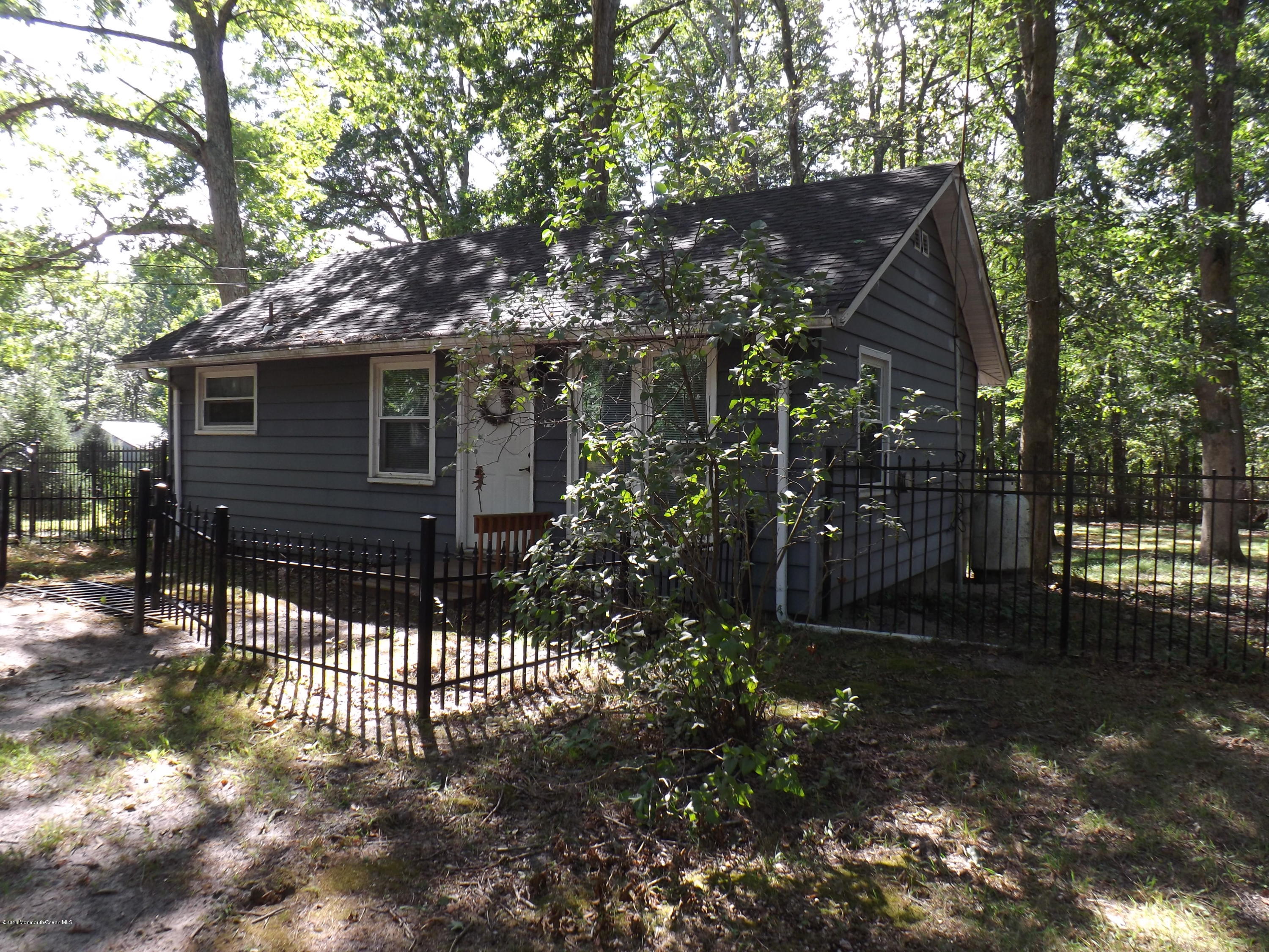 73 Lemon Road Howell, NJ 07731 - Photo 1 of 17 a front view of a house with a tree