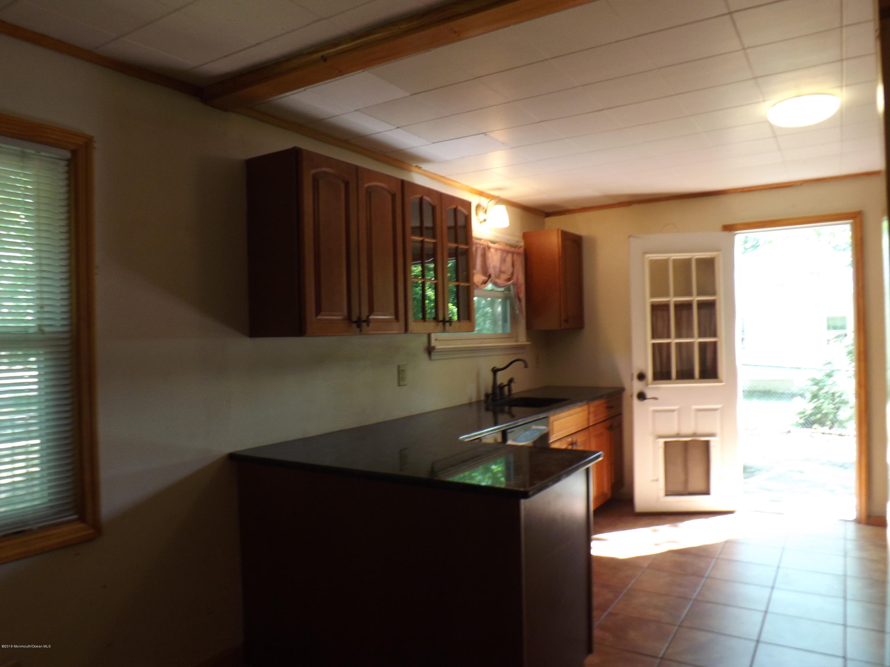 73 Lemon Road Howell, NJ 07731 - Photo 4 of 17 a kitchen that has a sink and a stove in it