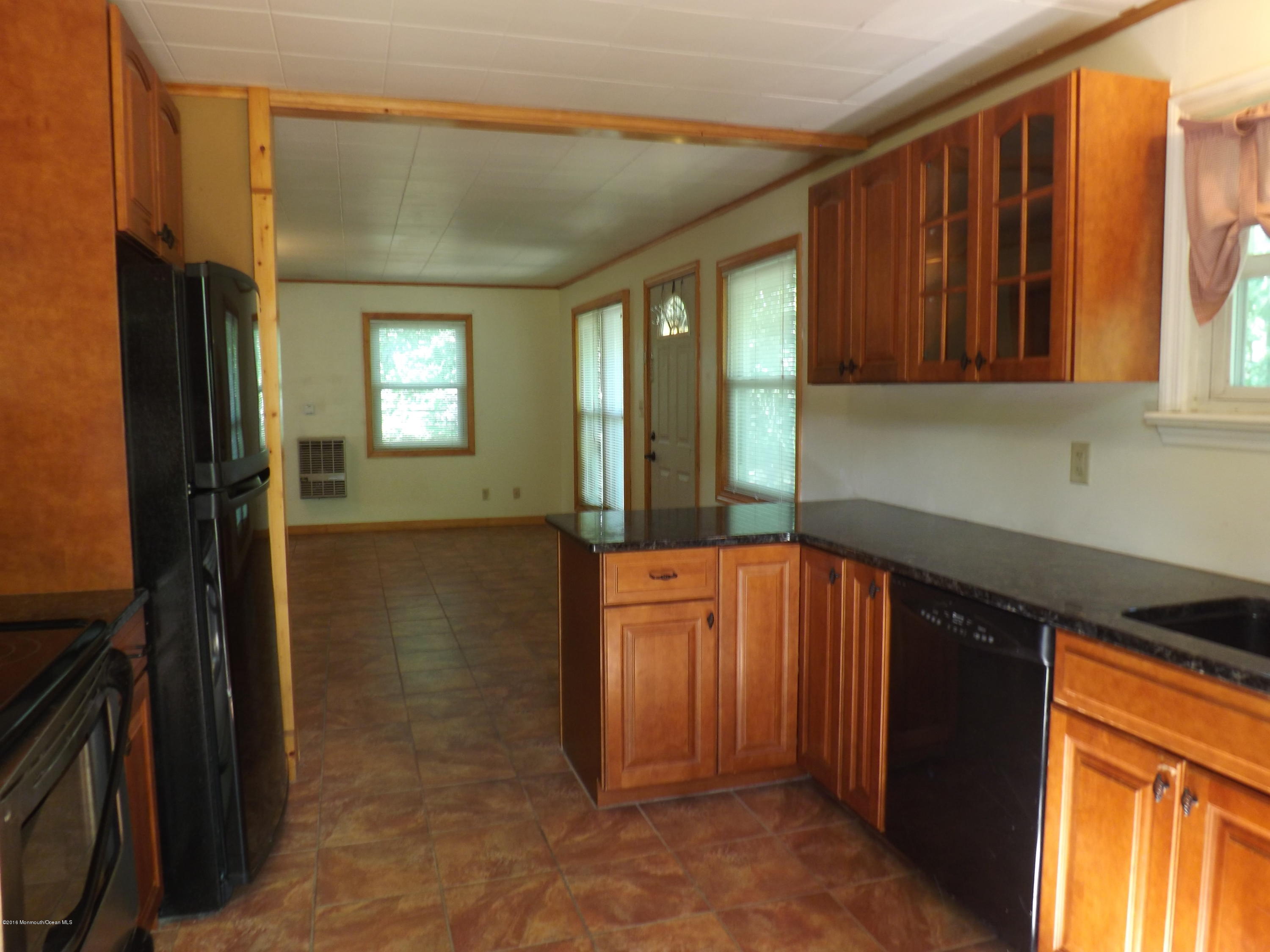 73 Lemon Road Howell, NJ 07731 - Photo 7 of 17 a kitchen with stainless steel appliances granite countertop a refrigerator and a sink
