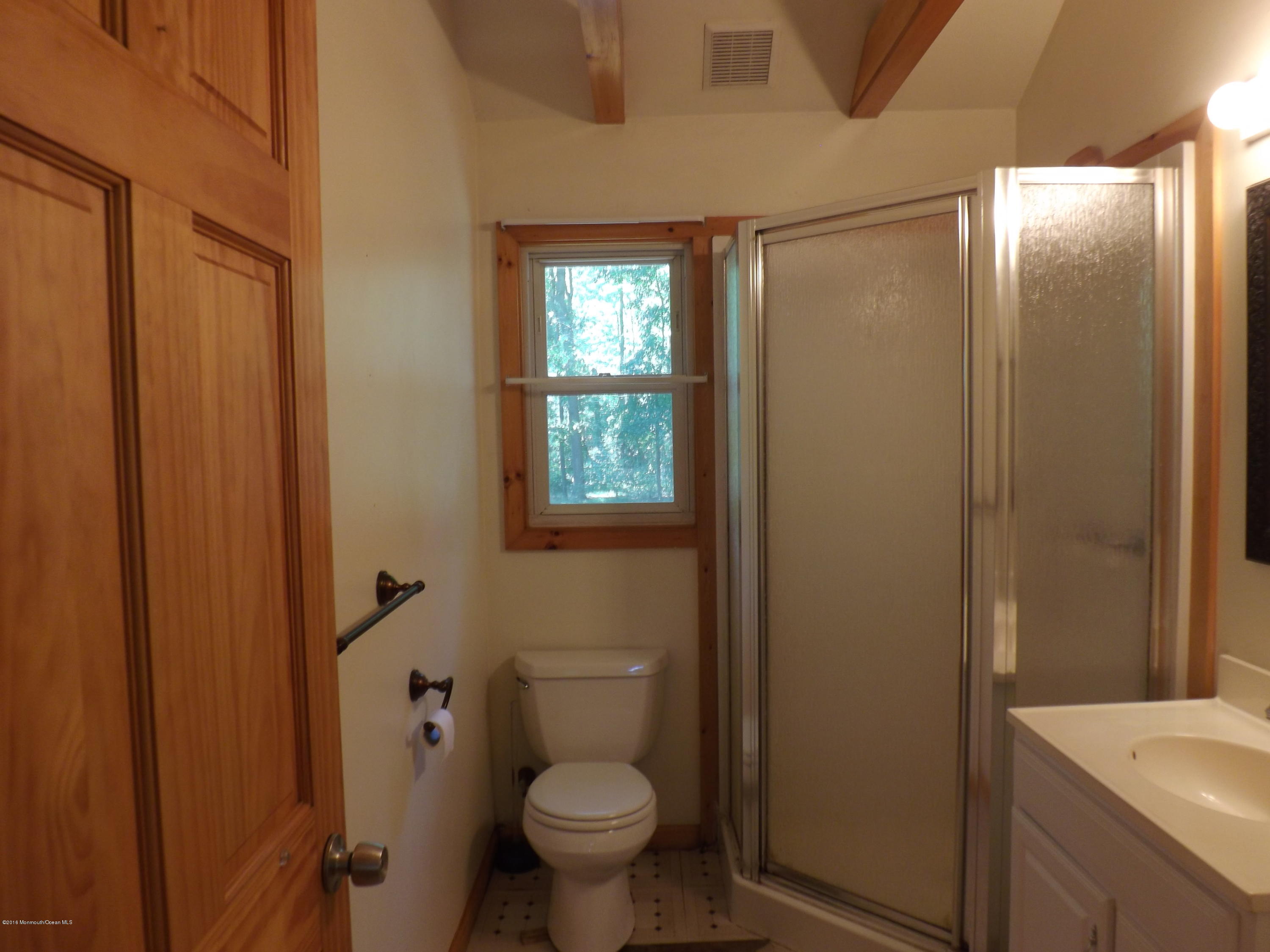 73 Lemon Road Howell, NJ 07731 - Photo 8 of 17 a bathroom with a granite countertop sink toilet and shower