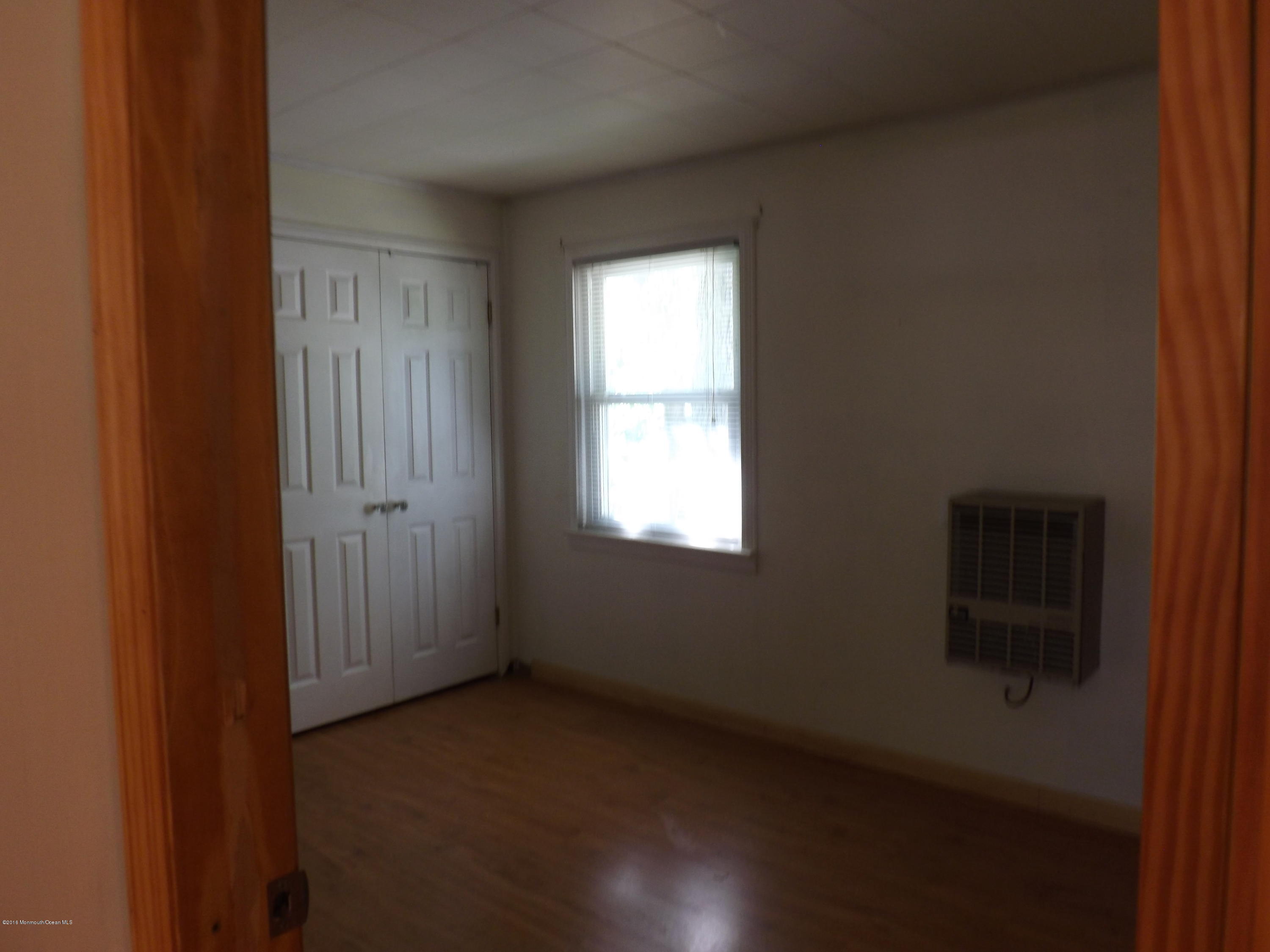 73 Lemon Road Howell, NJ 07731 - Photo 10 of 17 a view of an empty room with a window