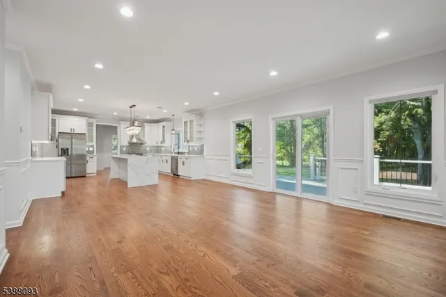 a view of kitchen with furniture and wooden floor