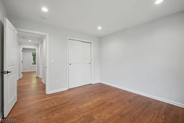 wooden floor in an empty room with a gallery