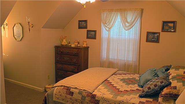 255 Biggs Road Cottontown, TN 37048 - Photo 12 of 18 This second bedroom is spacious and has a full size closet. Knee walls in both bedrooms allow for plenty of head room.