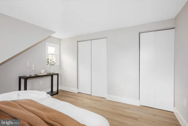 a bedroom with a bed and a table in it