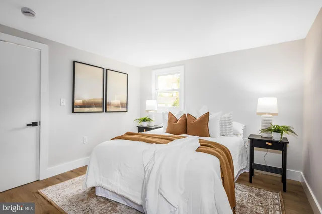 a bedroom with bed and a window