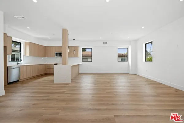 a view of kitchen with wooden floor