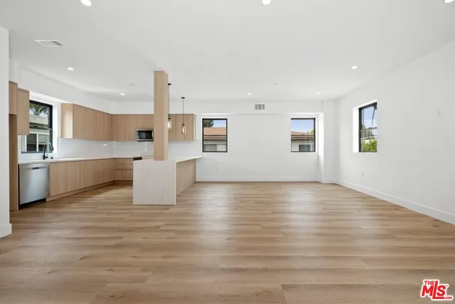 a view of kitchen with wooden floor